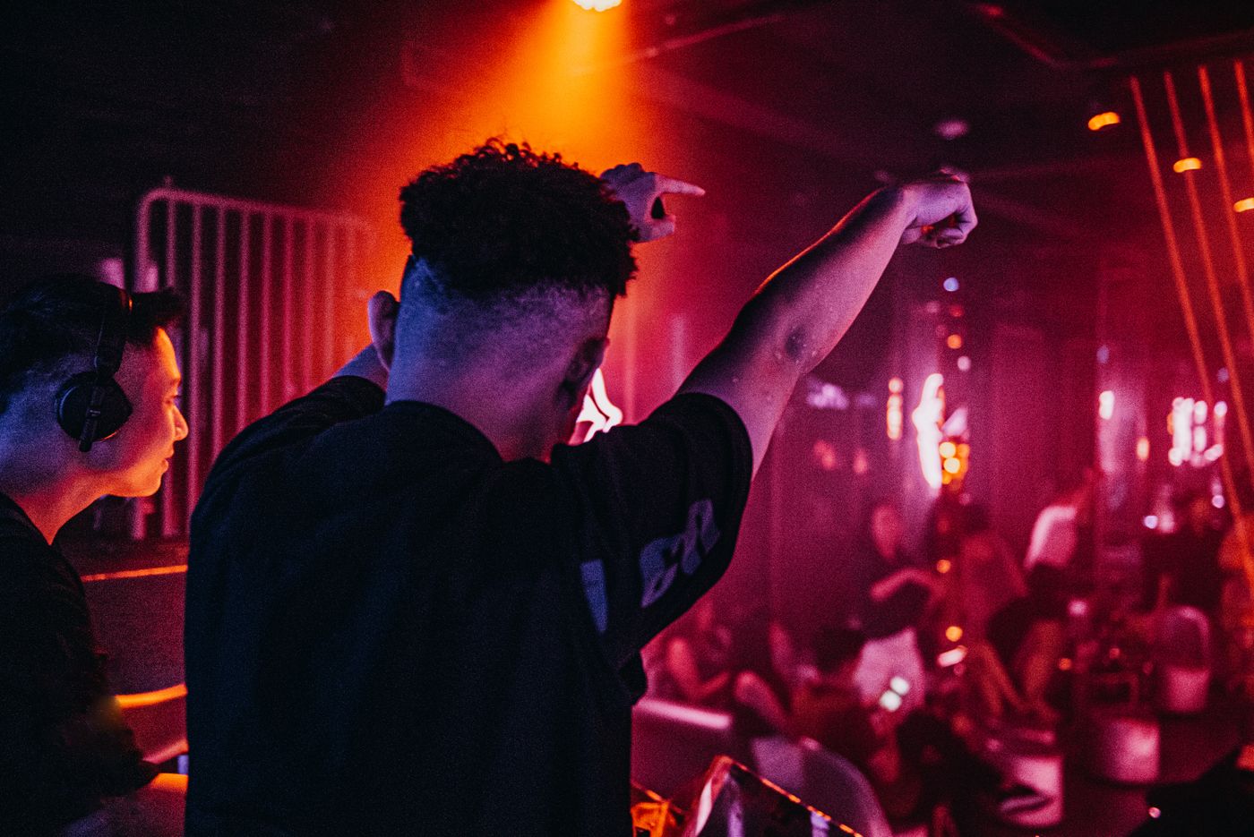 DJ with raised hands