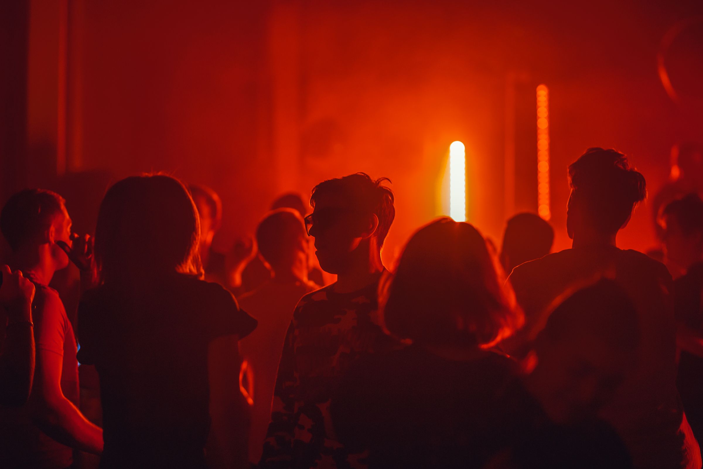 Club atmosphere under warm red lights